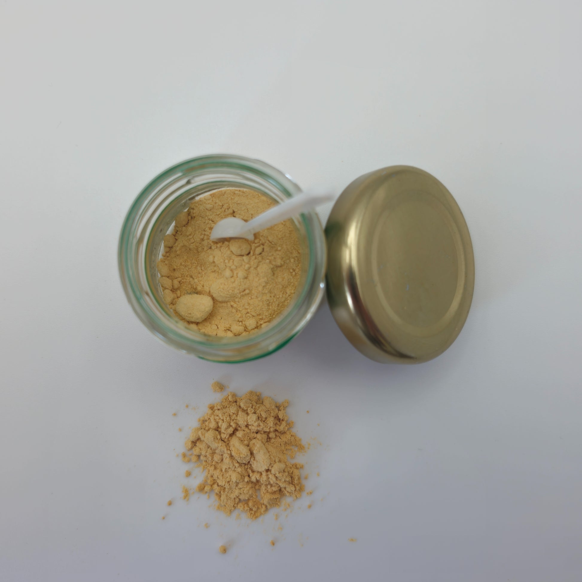 Photo of TA10 Sceletium extract powder from the top with the jar it comes in.