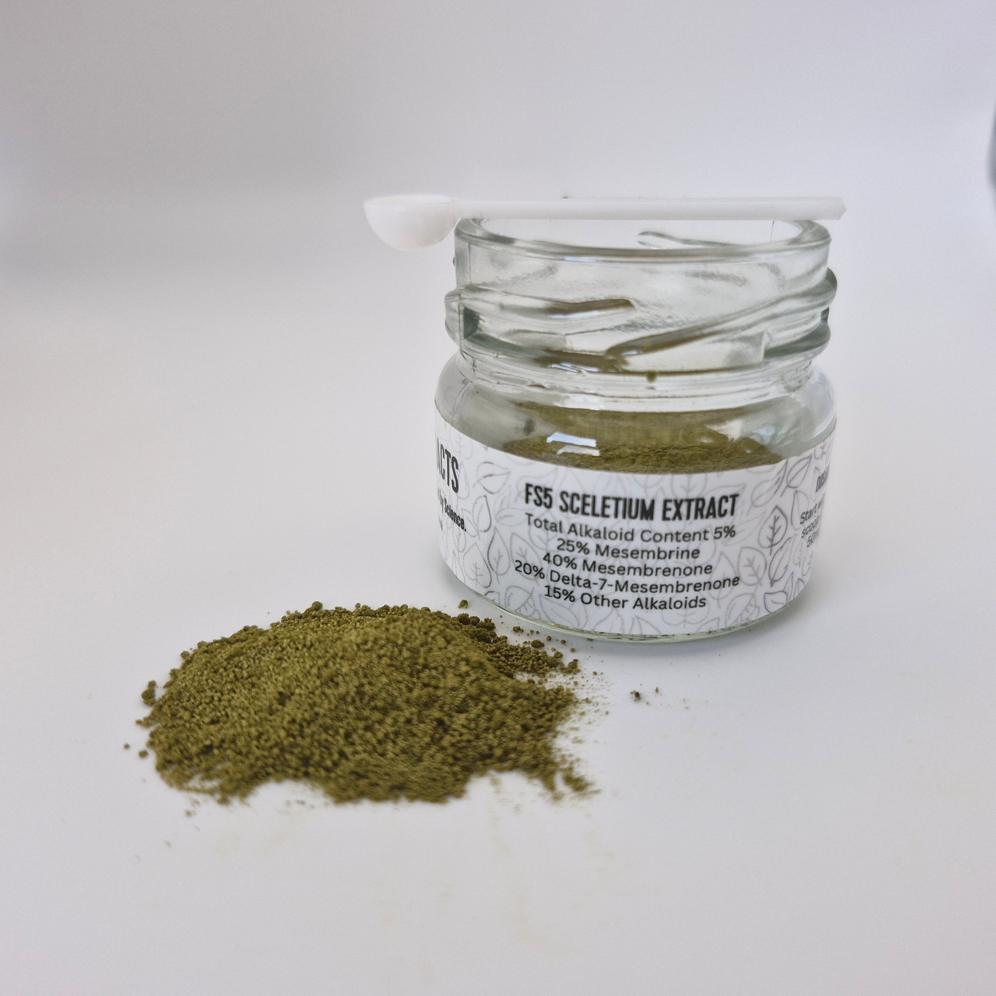 Photo of Full Spectrum Sceletium extract powder from the front with the labeled jar it comes in as well as the spoon on top.