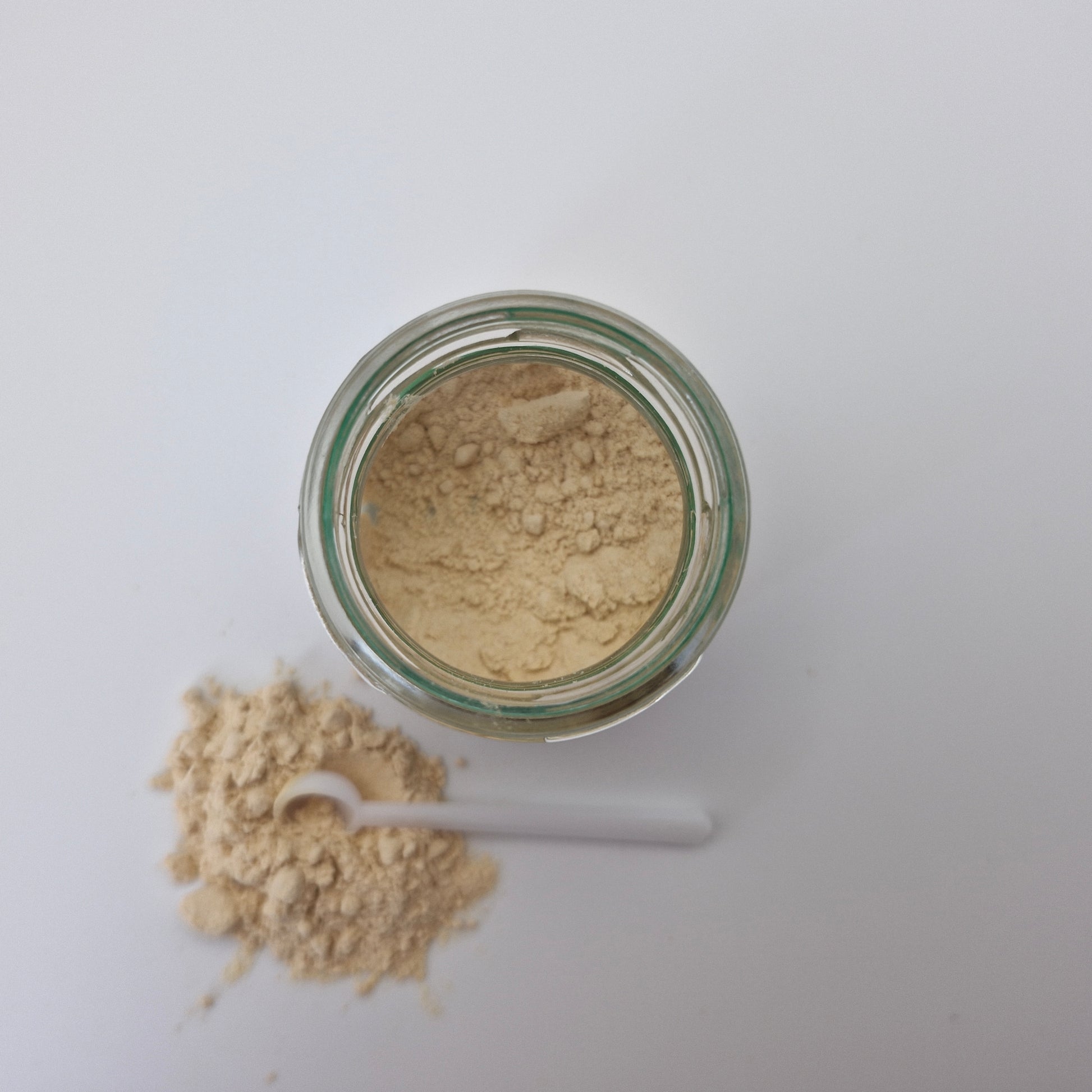 Photo of Serene Sceletium extract powder from the top with an open jar it comes with.